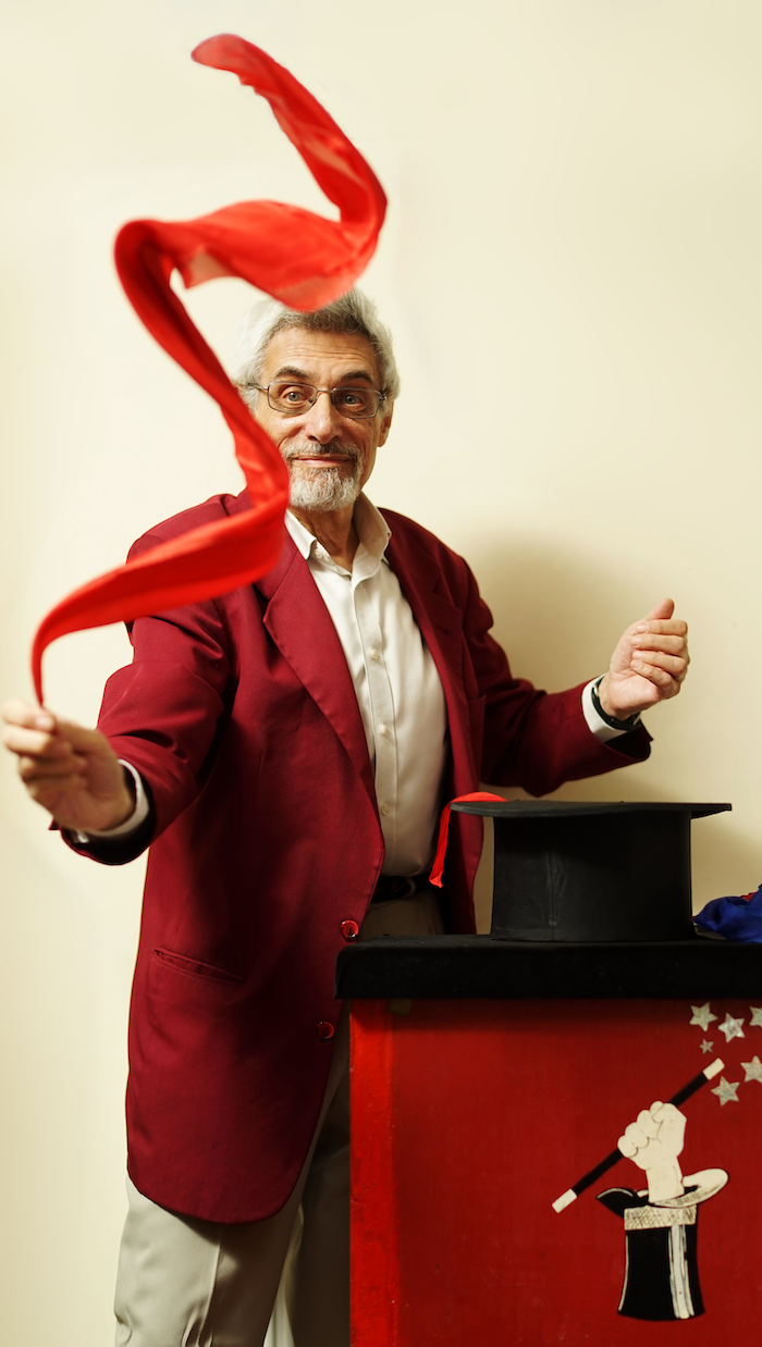 Ian Saville waving large red scarf